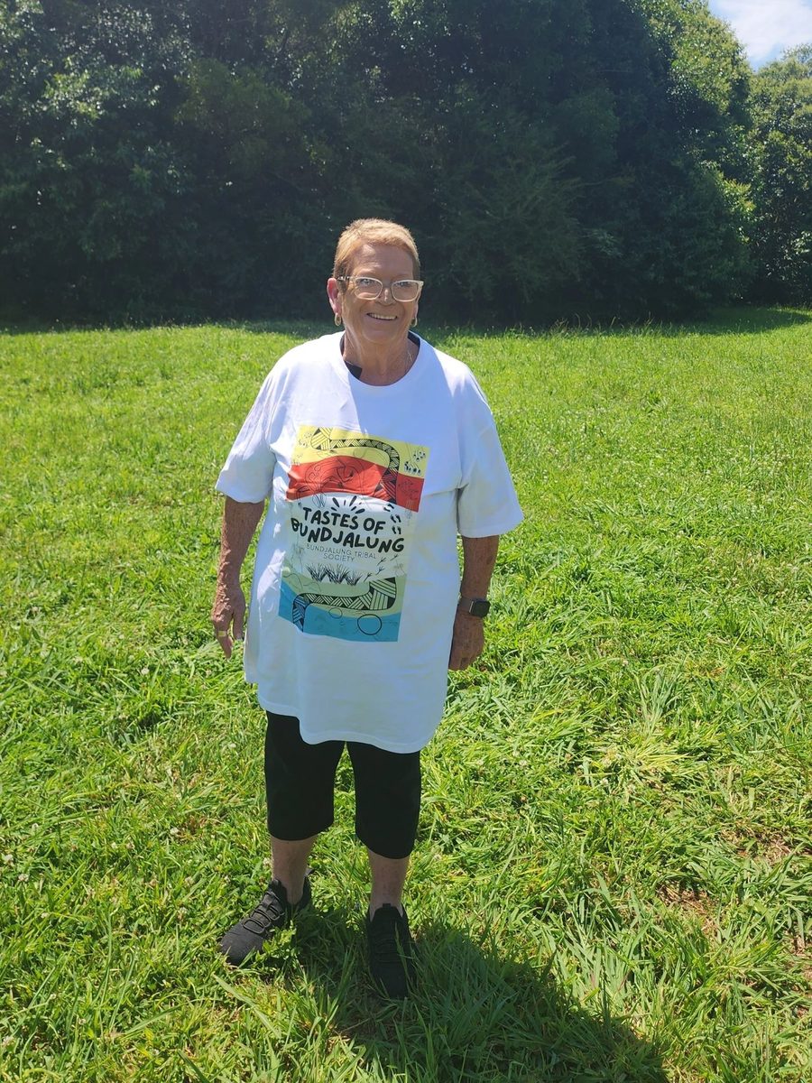 Community member wearing the front design shirt at Namabunda Farm